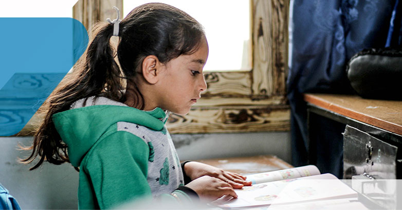 girl reading at her desk