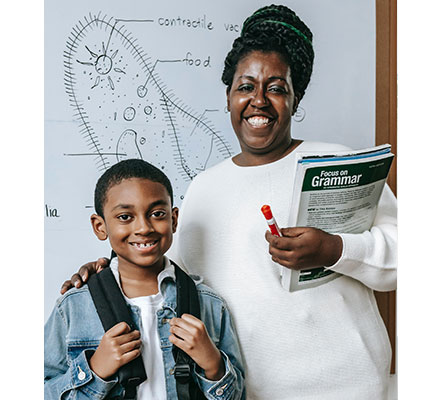 parent and child smiling in classroom
